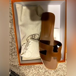 Size 42 Hermes slippers. Never won